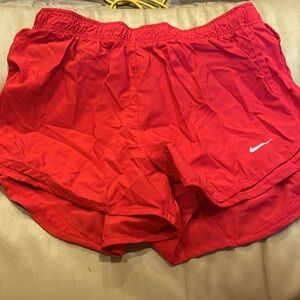 Red Nike shorts